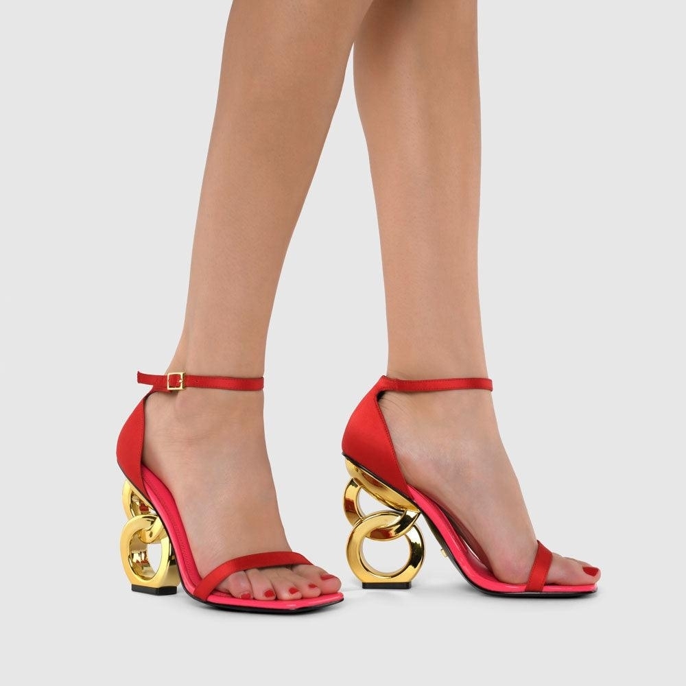 Chic Red Heels with Gold Artistic Design